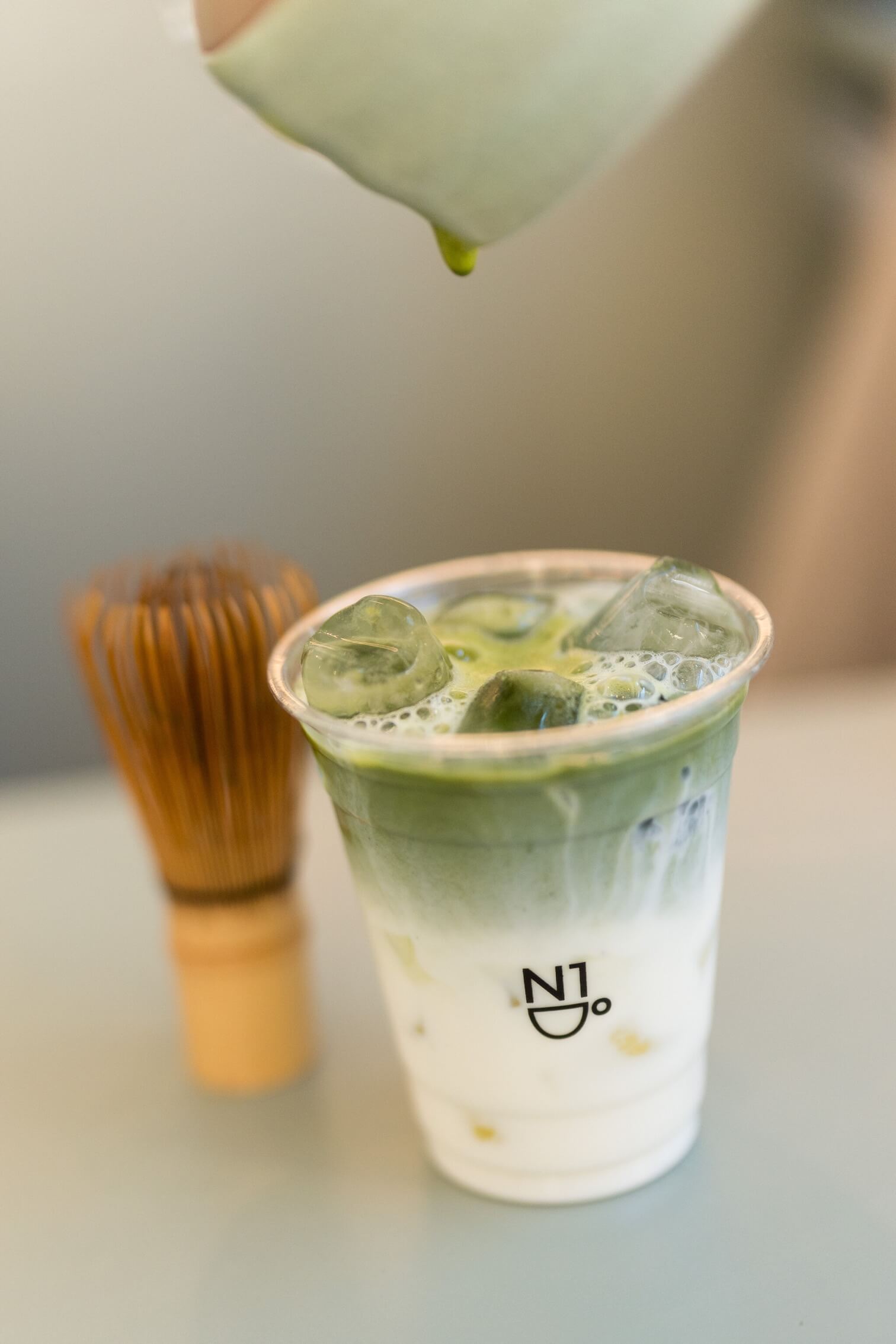 Iced matcha being prepared at N1 Coffee Milano